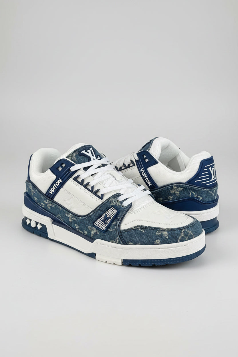 White and blue sneakers with Louis Vuitton branding in a box.